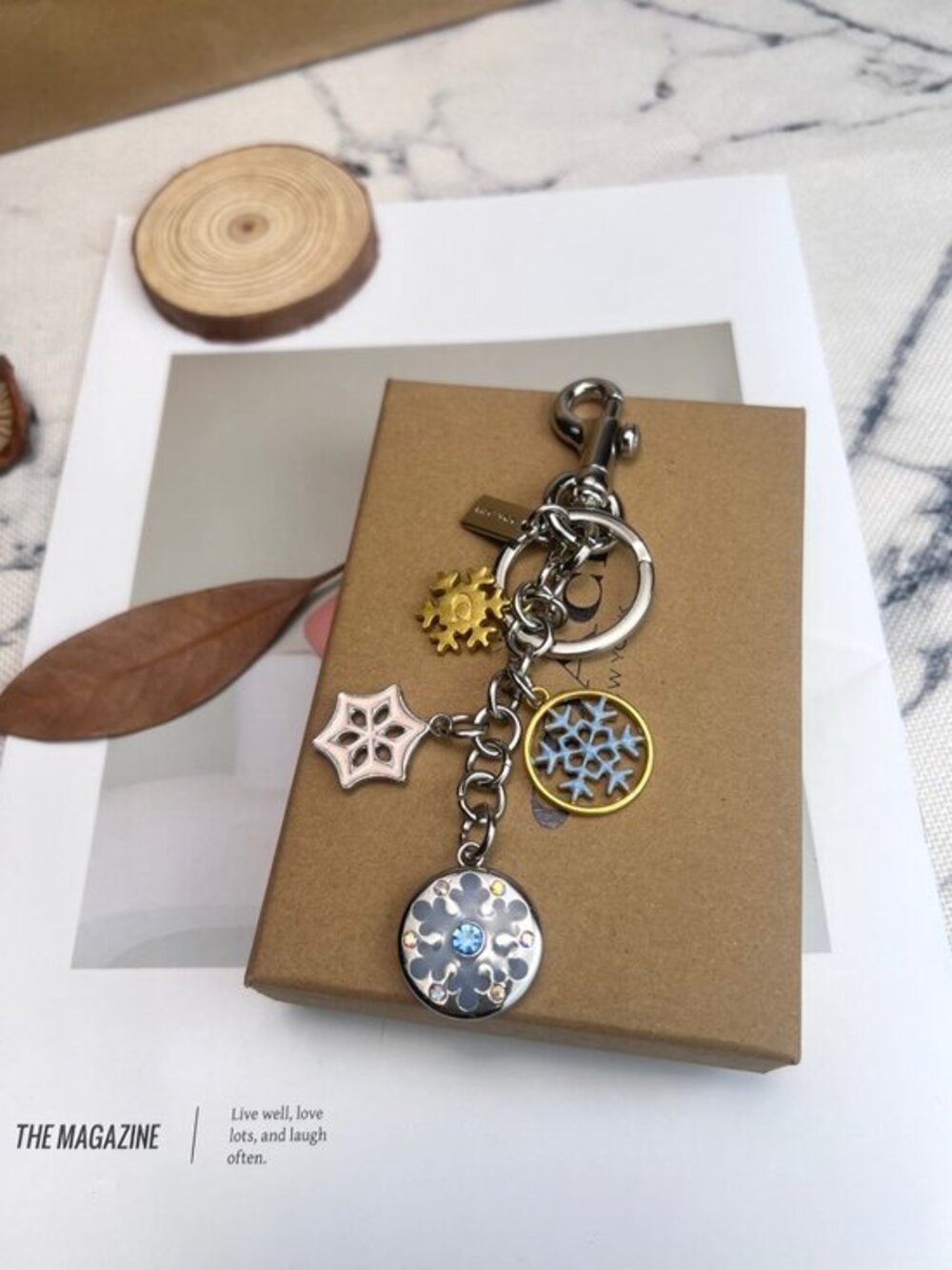 Coach Silver-Tone & Light Blue Snowflake Charm Keychain with Gold Accent